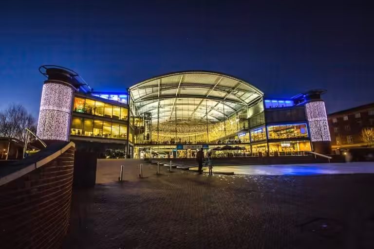 The Forum in Norwich illuminated at night, captured with soft lighting and clear architectural detail. – WinuSoft | Norwich Web Design Company